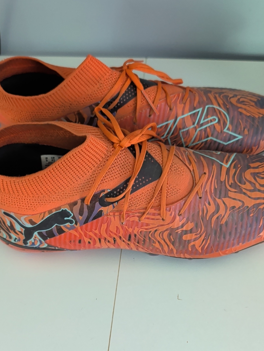 Puma Orange and Black Tiger-Stripe Soccer Cleats